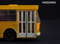 Масштабная модель 1:43 Городской автобус ЛАЗ-4202, желтый с журналом №12 (Наши Автобусы. Modimio)