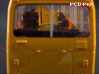 Масштабная модель 1:43 Городской автобус ЛАЗ-4202, желтый с журналом №12 (Наши Автобусы. Modimio)